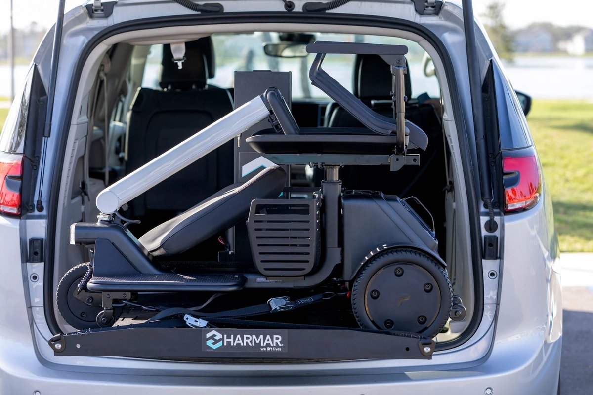 Power chair secured on the AL600 platform in the back of a silver minivan