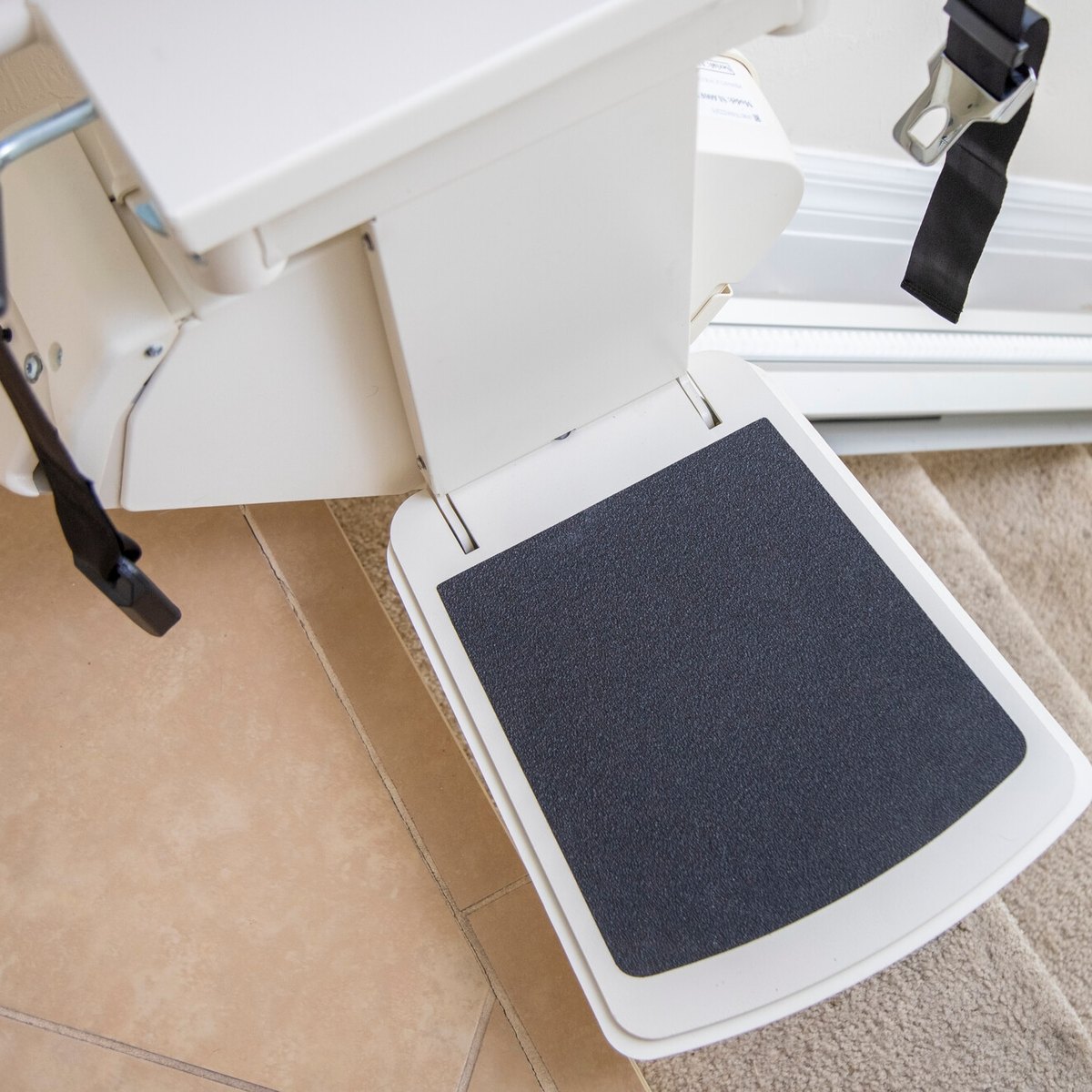 Harmar SL300 footrest above carpeted stairs